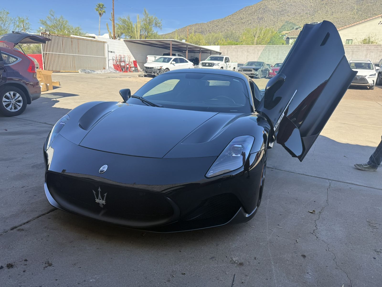 Maserati MC20 with doors open at Elwood Motorsports and Collision, Cave Creek AZ